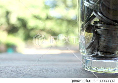 Coin in glass jar, Saving money concept. Coin in glass jar, Saving money concept. 43433348