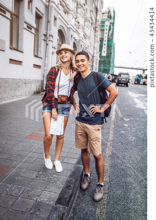 Stylish couple standing on street Stylish couple standing on street 43434414