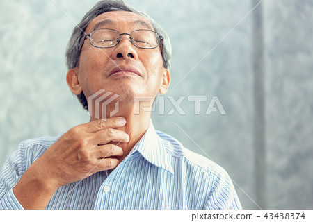 Senior man touching his neck and having pain Senior man touching his neck and having pain 43438374