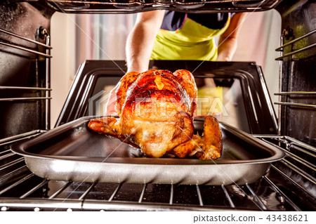 Cooking chicken in the oven at home. Cooking chicken in the oven at home. 43438621