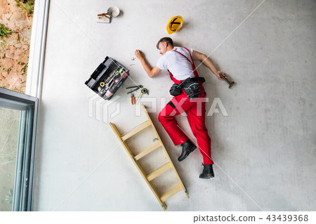 An accident of a man worker at the construction site. Top view. An accident of a man worker at the construction site. Top view. 43439368