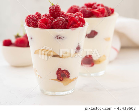 Raspberry dessert, cheesecake, raspberry tiramisu, trifle, mousse in a glass on a white background. Raspberry dessert, cheesecake, raspberry tiramisu, trifle, mousse in a glass on a white background. 43439608