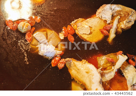 Close-up Chinese style soup stock with herbs mixed Close-up Chinese style soup stock with herbs mixed 43443562