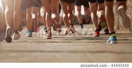Marathon running race in the light of evening 43444350