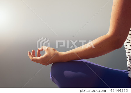 Hand of woman practicing meditation yoga 43444353
