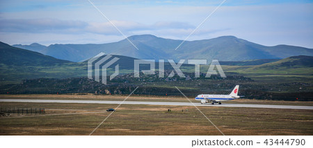 An Airbus airplane on mountainous runway 43444790