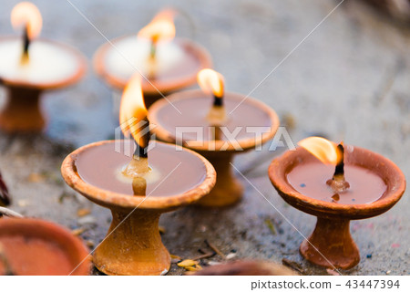 Terra-cota oil lamps as religious offerings  43447394