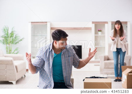Woman evicting man from house during family conflict Woman evicting man from house during family conflict 43451283
