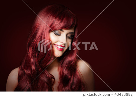 Smiling redhead woman fashion model on dark Smiling redhead woman fashion model on dark 43453892