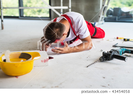 An accident of a man worker at the construction site. An accident of a man worker at the construction site. 43454058