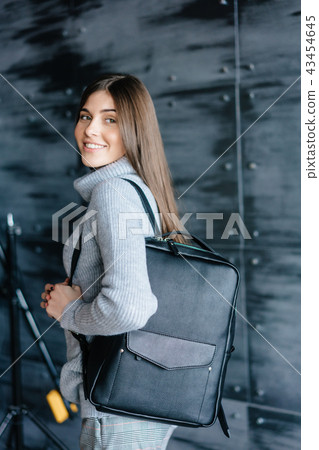 Fashionable woman hold black bag Fashionable woman hold black bag 43454645