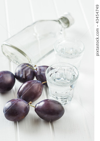 Plum brandy and plums. Slivovitz. Plum brandy and plums. Slivovitz. 43454749