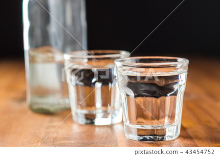 Vodka in shot glass. 43454752