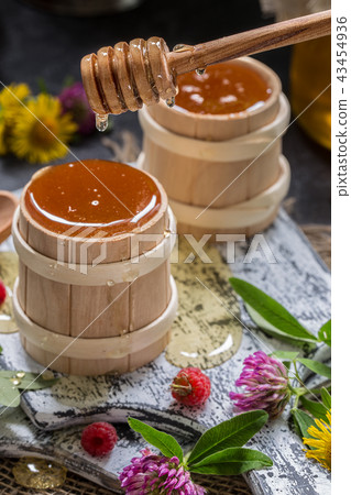 natural organic honey on a wooden table natural organic honey on a wooden table 43454936