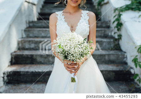 beautiful bouquet in hands of the bride beautiful bouquet in hands of the bride 43455293