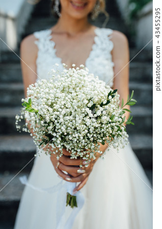 beautiful bouquet in hands of the bride beautiful bouquet in hands of the bride 43455295
