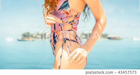 Happy young woman at beach in summer vacation. 43457573