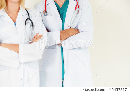 Portrait of confident doctors with arms crossed. Portrait of confident doctors with arms crossed. 43457817