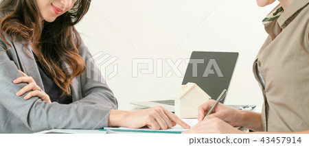 Client Signs Document to Buy House and Real Estate 43457914