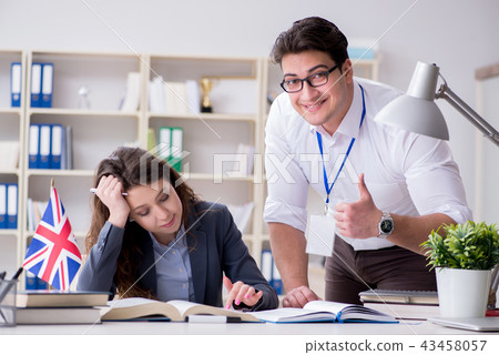 Teacher explaining to student at language training 43458057