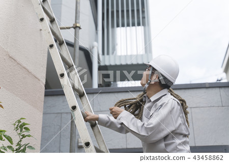 Businessman examining a construction site image / building climb a ladder Businessman examining a construction site image / building climb a ladder 43458862