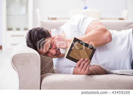 Young man unhappy in broken love concept Young man unhappy in broken love concept 43459109