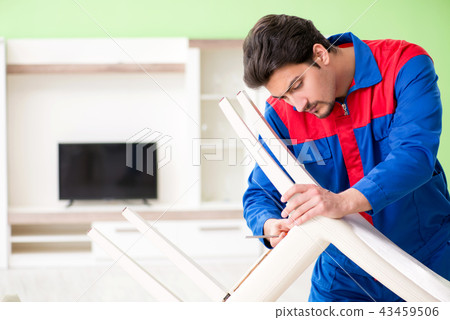 Repair contractor repairing broken chair at home Repair contractor repairing broken chair at home 43459506