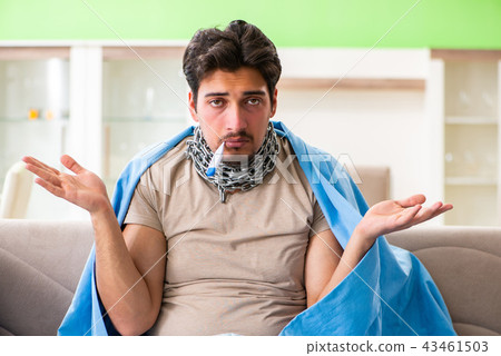 Sick young man suffering from flu at home 43461503