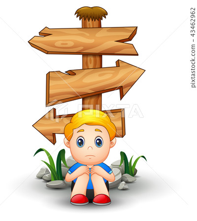 Sad boy sitting under blank wood arrow sign 43462962