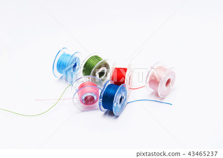 Thread, laces, colorful colourful bobbins of thread Thread, laces, colorful colourful bobbins of thread 43465237