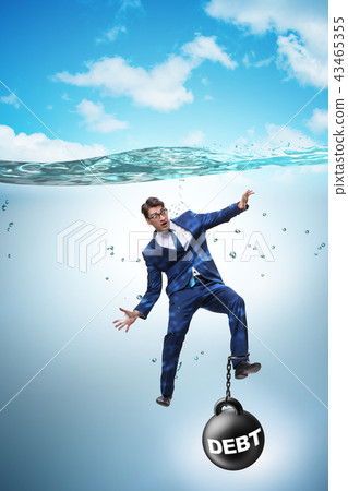 Businessman drowning in concept of high debt Businessman drowning in concept of high debt 43465355