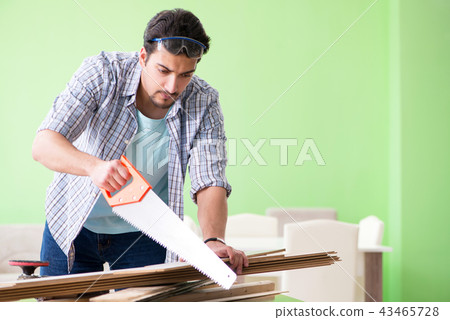 Woodworker working in his workshop Woodworker working in his workshop 43465728