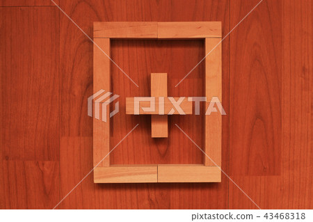 Wooden blocks in shape of Cross in frame 43468318