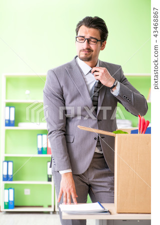 Male employee collecting his stuff after redundancy 43468867