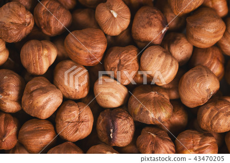 Roasted hazelnuts background top view Roasted hazelnuts background top view 43470205