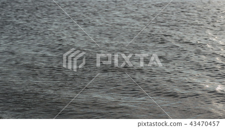 waves on a beach on a windy sunny day 43470457