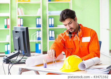 Construction supervisor planning new project in office 43471382