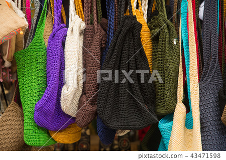 Colorful handcraft bag in the market. Handmade bag 43471598