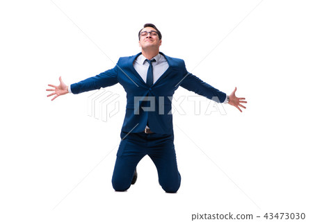 Excited businessman siiting on the knees isolated on white backg 43473030