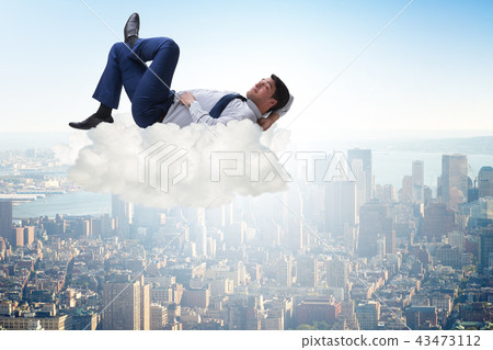 Young male businessman enjoying his time during vacation Young male businessman enjoying his time during vacation 43473112