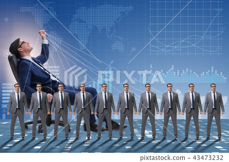 Boss employee manipulating his staff in business concept Boss employee manipulating his staff in business concept 43473232
