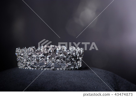 Diamond Silver Crown for Miss Pageant Beauty queen Contest, Crystal Tiara jewelry decorated gems stone and black velvet fabric cloth, photography copy space for text logo 43474873