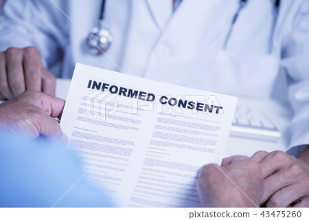 senior man reading an informed consent senior man reading an informed consent 43475260
