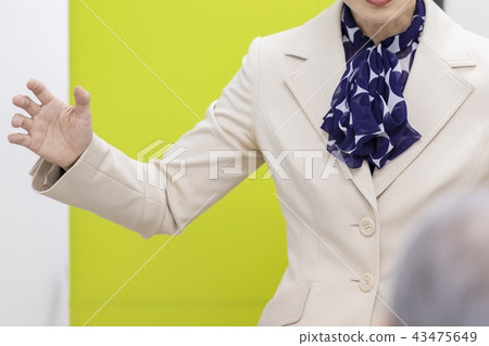 A woman talking at a seminar A woman talking at a seminar 43475649