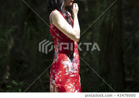 A woman in a Chinese dress A woman in a Chinese dress 43476000