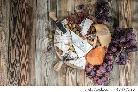 Different sorts of cheese and grapes Different sorts of cheese and grapes 43477589