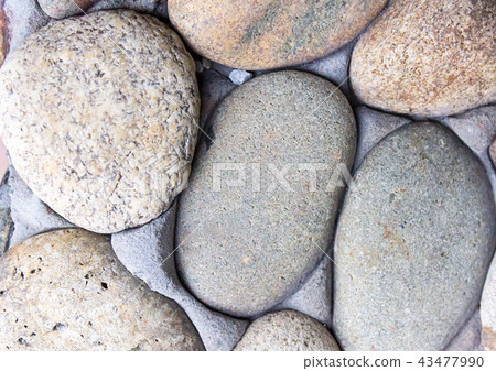 wall gray cobblestone with cement part of the wall 43477990