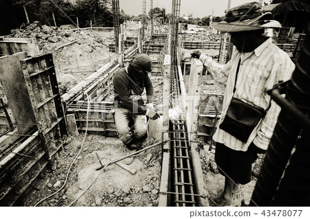 Monochrome of workers welding the steel 43478077