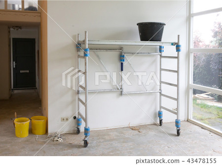 Worker tools - Bucket standing on scaffolding 43478155