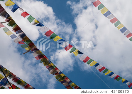 Nepal flags on clear blue sky with cumulus clouds Nepal flags on clear blue sky with cumulus clouds 43480570